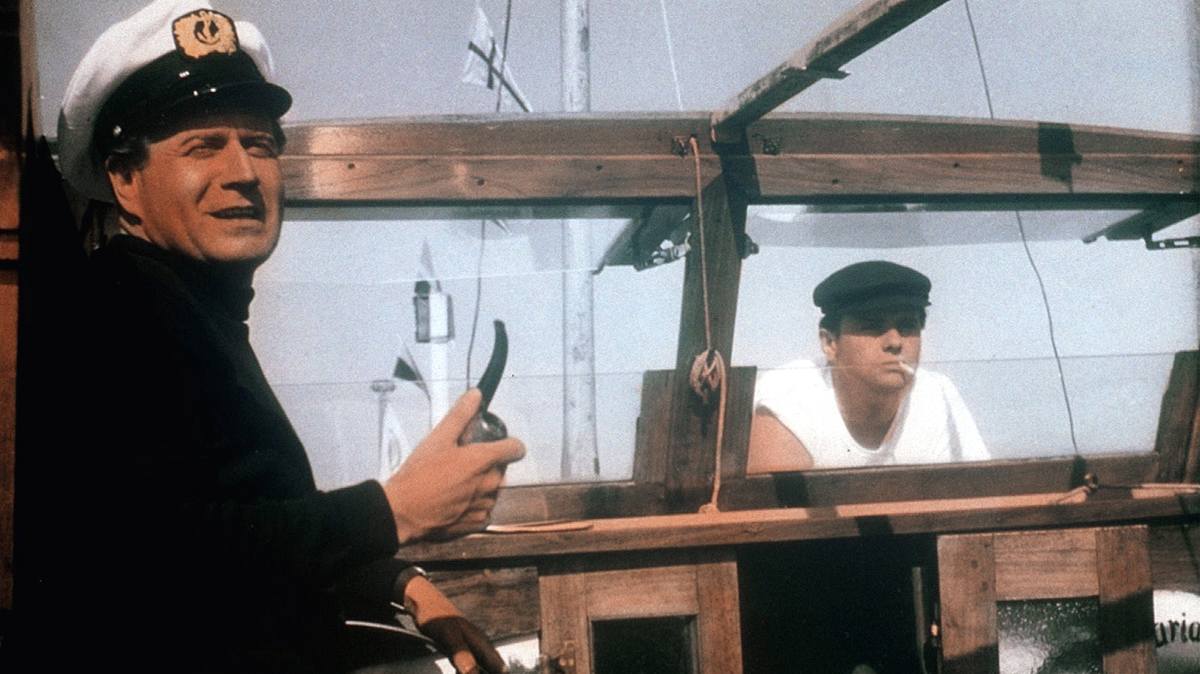 drei mann in einem boot