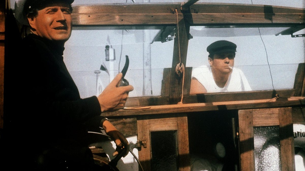 drei mann in einem boot