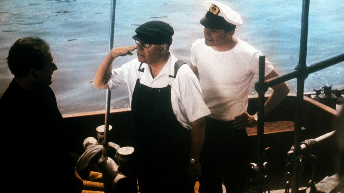 drei mann in einem boot