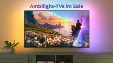 Ambilight TV auf TV-Board mit aktiviertem Ambilight - Foto: TV Movie / Philips Ambilight TV auf TV-Board mit aktiviertem Ambilight - Foto: TV Movie / Philips