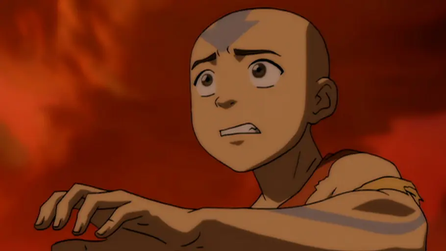 Avatar Der junge Avatar Aang blickt mit besorgtem Gesichtsausdruck in eine von Feuer und roten Flammen erhellte Umgebung – eine Szene aus der Animationsserie „Avatar: Der Herr der Elemente“.