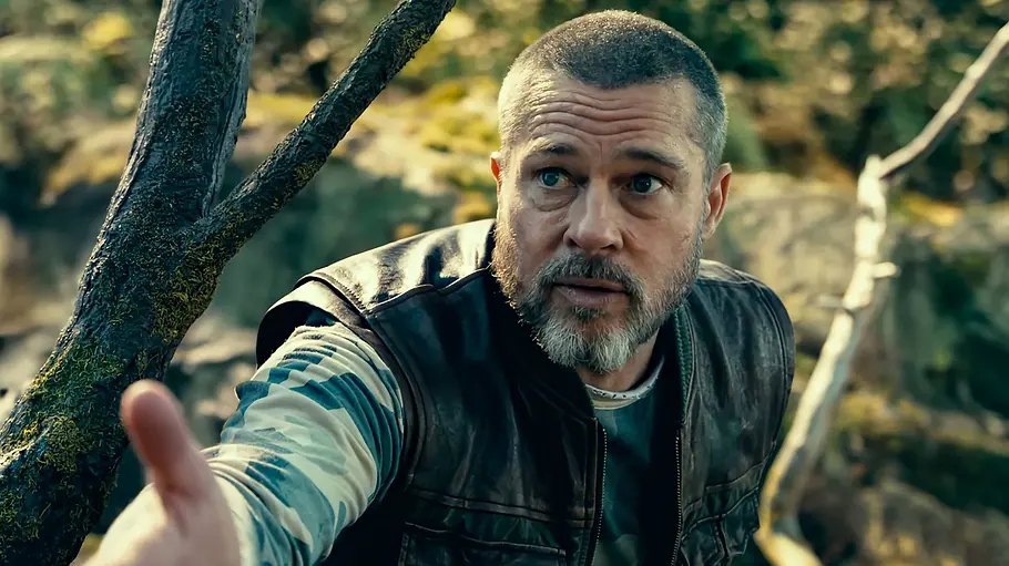 Brad Pitt erwartet viel von Pornostars und wird immer wieder enttäuscht. Brad Pitt im Film Eiserne Wildnis, er streckt seine Hand aus.