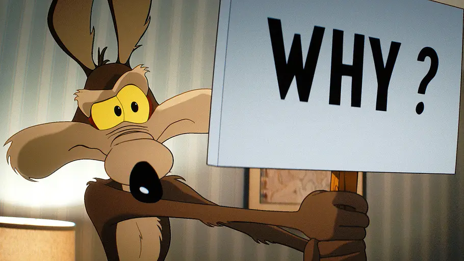 Coyote vs. ACME Wille E. Coyote hält ein Schild mit der Aufschrift „Why“ hoch.