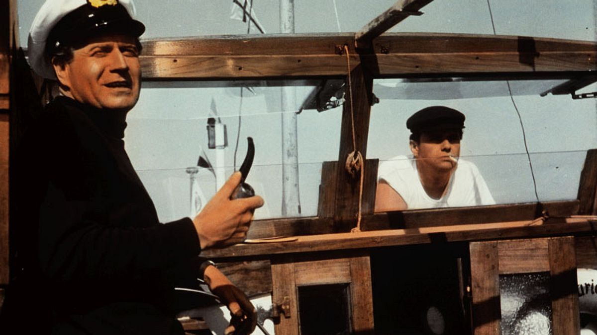drei mann in einem boot