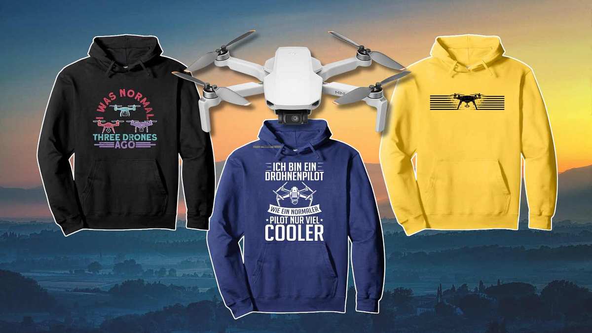 Drei Hoodies mit Drohnen-Aufdruck und eine DJI Drohne vor einem Hintergrund mit Sonnenuntergang