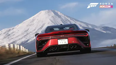 Ein Auto fährt in Forza Horizon 6 auf einer Straße vor dem Mount Fuji - Foto: Xbox / Playground Games