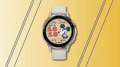 Garmin Smartwatch mit Retro-Mickey-Mouse-Display vor einem gelb-orangenen Hintergrund - Foto: Garmin/PR