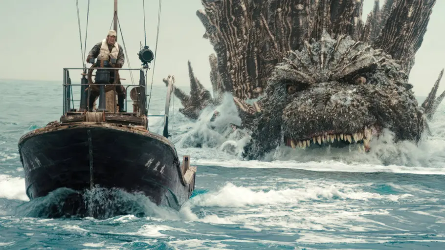 Godzilla Minus One Godzilla verfolgt ein Schiff auf dem Wasser.