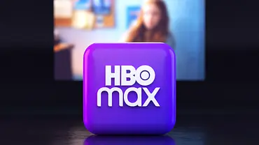 Lila Würfel mit HBO-Max-Logo vor einem Fernseher. - Foto: IMAGO / Pond5 Images