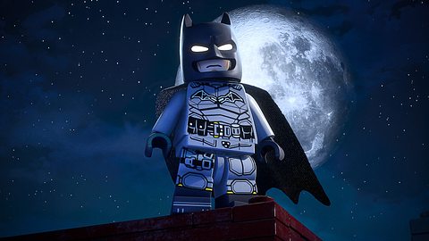 Ein Lego Batman steht vor einem gigantischen Mond. Es handelt sich um eine Zwischensequenz aus Lego Batman: Legacy of the Dark Knight - Foto: TTGames