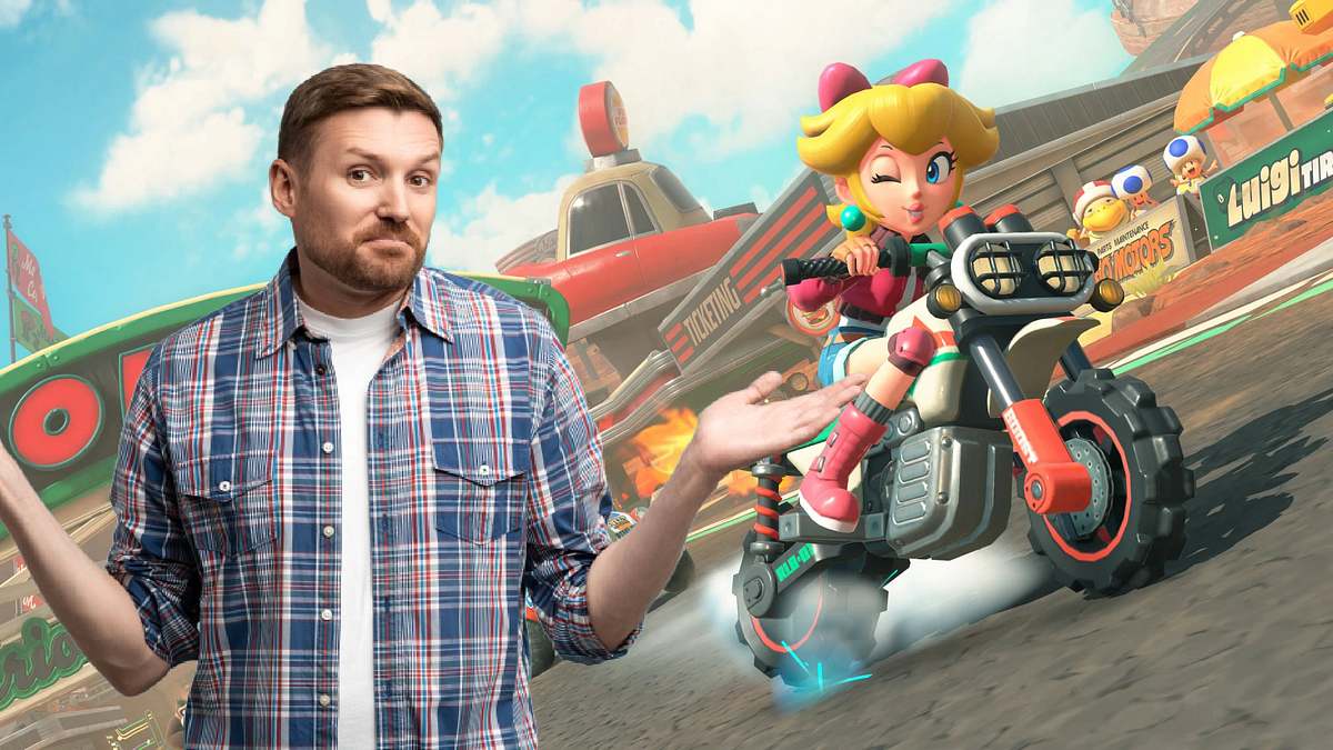„Mario Kart World“ ist das größte - und teuerste - Spiel zum Start der Switch 2. Ein Mann breitet die Hände zur Seite aus hebt die Schultern. Im Hintergrund sieht man Prinzessin Peach auf einem Motorrad.