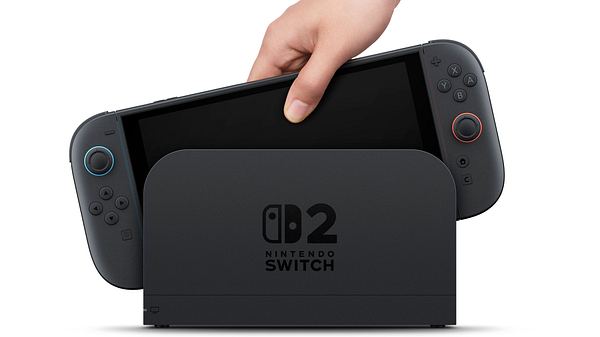 Auf dem Bild sieht man eine Nintendo Switch 2. Der  Handheld wird gerade in die Docking-Station gesteckt - Foto: Nintendo 