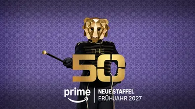 Werbegrafik zur Reality-Show „The 50“ auf Prime Video. Vor einem violett gemusterten Hintergrund steht eine Person in schwarzer Uniform mit einer goldenen Löwenmaske und hält einen Taktstock in der Hand. Im Vordergrund befindet sich das goldene Logo „The 50“ sowie der Hinweis „Neue Staffel Frühjahr 2027“ und das Prime-Video-Logo. Die Gestaltung wirkt geheimnisvoll und inszeniert den Löwen als zentrale Symbolfigur der Show. - Foto: Prime Video Werbegrafik zur Reality-Show „The 50“ auf Prime Video. Vor einem violett gemusterten Hintergrund steht eine Person in schwarzer Uniform mit einer goldenen Löwenmaske und hält einen Taktstock in der Hand. Im Vordergrund befindet sich das goldene Logo „The 50“ sowie der Hinweis „Neue Staffel Frühjahr 2027“ und das Prime-Video-Logo. Die Gestaltung wirkt geheimnisvoll und inszeniert den Löwen als zentrale Symbolfigur der Show. - Foto: Prime Video