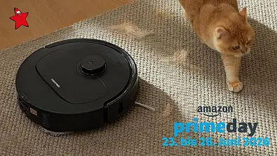 Schwarzer Roborock Saugroboter fährt über einen hellen Teppich, daneben läuft eine orangefarbene Katze. Rechts im Bild steht der Text „amazon primeday 23. bis 26. Juni 2026“. - Foto: Amazon/PR Schwarzer Roborock Saugroboter fährt über einen hellen Teppich, daneben läuft eine orangefarbene Katze. Rechts im Bild steht der Text „amazon primeday 23. bis 26. Juni 2026“. - Foto: Amazon/PR