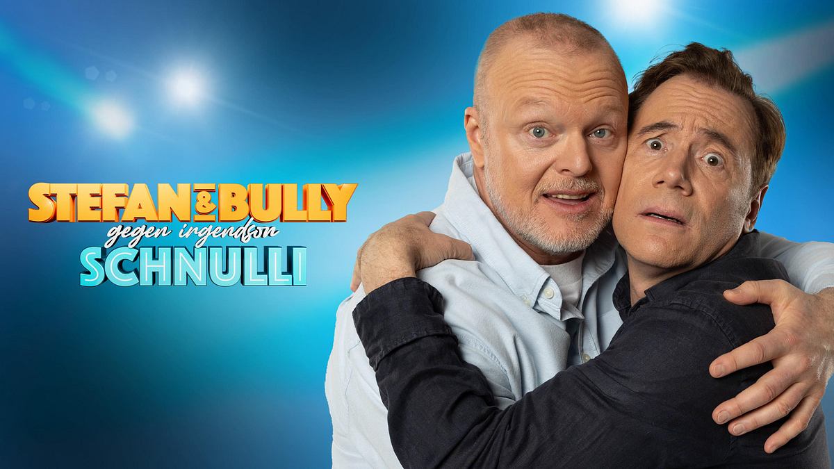 Stefan Raab & Bully gegen irgendson Schnulli Stefan Raab und Michael Bully Herbig umarmen sich auf der rechten Seite des Plakats zu Stefan & Bully gegen irgendson Schnulli