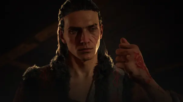 Coen schaut zur Seite, während der seine blutende Hand zusammendrückt. - Foto: Bandai Namco / 