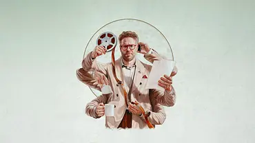 Poster der Serie The Studio. Man kann Seth Rogen als Matt Remick sehen, der sechs Arme hat und in diesen filmbezogene Gegenstände hält. - Foto: TMDB Poster der Serie The Studio. Man kann Seth Rogen als Matt Remick sehen, der sechs Arme hat und in diesen filmbezogene Gegenstände hält. - Foto: TMDB