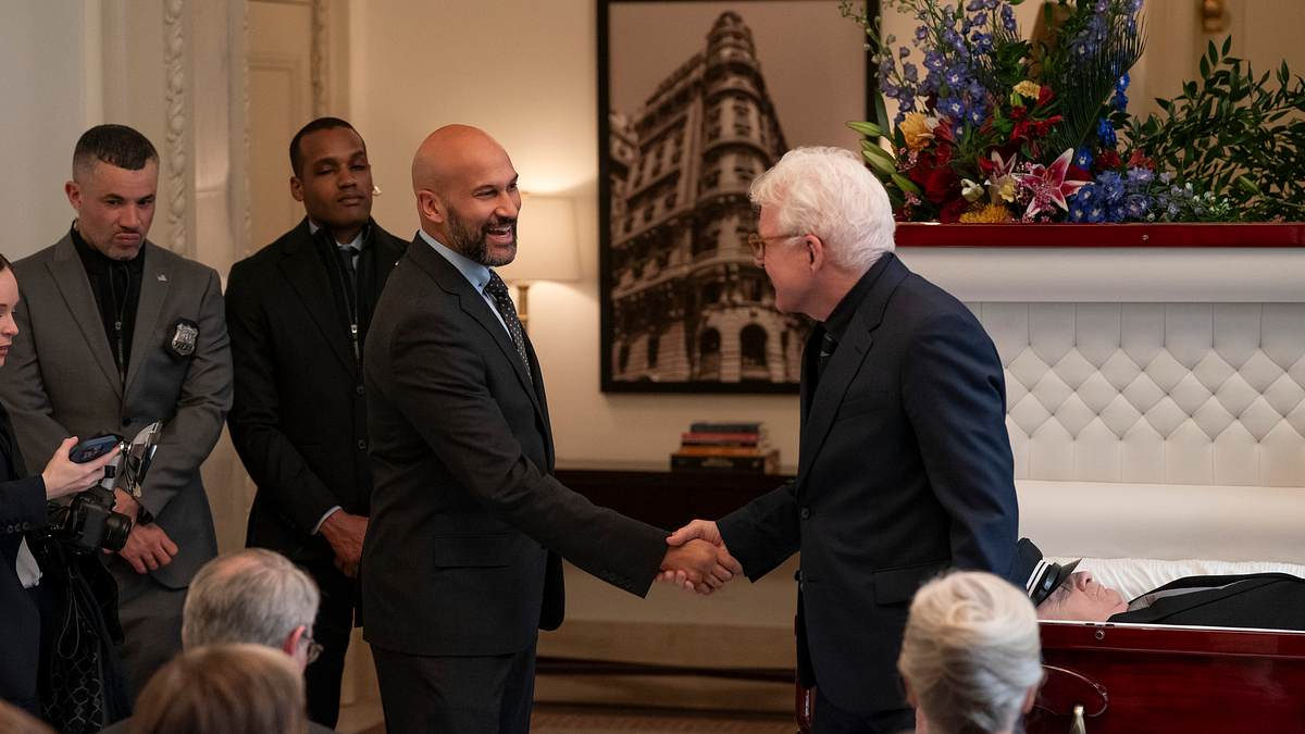 Charles trifft Bürgermeister Tillman und schüttelt ihm die Hand.
